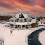 Jenkins Township home exterior, snow covered with clean asphalt driveway