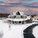 Jenkins Township home exterior, snow covered with clean asphalt driveway